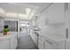 Bright kitchen with white cabinets, stainless steel appliances, and an island at 6363 Gulf Winds Dr # 437, St Pete Beach, FL 33706