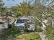 Aerial view of a house with a backyard, shed, and surrounding trees at 6709 S Faul St, Tampa, FL 33616