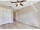 Bright bedroom with ceiling fan, ample closet space, and vinyl flooring at 719 Winterbrooke Way, Sun City Center, FL 33573