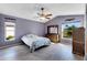 Main bedroom with vaulted ceilings, light walls and wood flooring at 719 Winterbrooke Way, Sun City Center, FL 33573