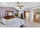 Main bedroom with light walls, wood flooring, and a ceiling fan at 719 Winterbrooke Way, Sun City Center, FL 33573