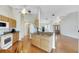 Open kitchen with granite countertops and wood cabinets at 719 Winterbrooke Way, Sun City Center, FL 33573