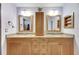 Double vanity bathroom with granite countertops and ample storage at 719 Winterbrooke Way, Sun City Center, FL 33573