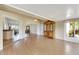 Spacious sunroom with wood flooring, large windows, and built-in hutch at 719 Winterbrooke Way, Sun City Center, FL 33573