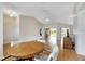 Bright dining area with a round table and access to other rooms at 719 Winterbrooke Way, Sun City Center, FL 33573