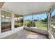 Spacious screened porch with view of the backyard and surrounding area at 719 Winterbrooke Way, Sun City Center, FL 33573