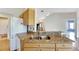 Granite countertops and double sink in this kitchen at 719 Winterbrooke Way, Sun City Center, FL 33573