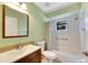 Bathroom with vanity, toilet, and shower/tub combo at 719 Winterbrooke Way, Sun City Center, FL 33573