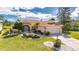 Beautiful home with well-maintained landscaping and a two-car garage at 719 Winterbrooke Way, Sun City Center, FL 33573