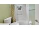 Clean bathroom with shower/tub combo, toilet and updated fixtures at 719 Winterbrooke Way, Sun City Center, FL 33573
