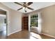 Bedroom with wood flooring, large window, and corner shelving at 719 Winterbrooke Way, Sun City Center, FL 33573