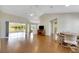 Bright living room with hardwood floors and access to a sunroom at 719 Winterbrooke Way, Sun City Center, FL 33573