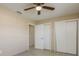 Bedroom with double door closet and access to the hallway at 8832 Huntsman Ln, Port Richey, FL 34668