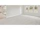Open bedroom with sliding doors and neutral carpeting at 13110 Homestead Ln, Parrish, FL 34219