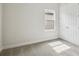 Bright bedroom featuring carpet, a window, and a closet with sliding doors at 13110 Homestead Ln, Parrish, FL 34219