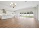 Bright, airy living room with wood floors and sliding glass doors leading to the backyard at 13110 Homestead Ln, Parrish, FL 34219