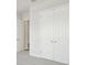 Empty bedroom featuring neutral carpet, closet doors and natural light from a window at 13138 Homestead Ln, Parrish, FL 34219