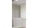 Second story landing with a large white door offering easy access to bedrooms and baths at 13138 Homestead Ln, Parrish, FL 34219