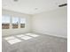 Bright, spacious bedroom with three windows overlooking the neighborhood at 13804 Heartwood Way, Parrish, FL 34219