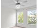 Bright bedroom with ceiling fan and large windows at 18001 Richmond Place Dr # 734, Tampa, FL 33647
