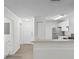 Entryway with view into kitchen and neutral colored floors at 18001 Richmond Place Dr # 734, Tampa, FL 33647