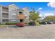 Exterior view of a two-story apartment building with parking at 18001 Richmond Place Dr # 734, Tampa, FL 33647