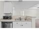 Kitchen features a double sink, microwave, and dishwasher at 18001 Richmond Place Dr # 734, Tampa, FL 33647