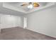 Spacious living room with carpeted floors and ceiling fan at 18001 Richmond Place Dr # 734, Tampa, FL 33647