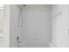 Clean bathroom with white tiled walls and a shower/tub combo at 18001 Richmond Place Dr # 734, Tampa, FL 33647