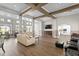 Community room with comfortable seating, a large TV, and hardwood floors at 18001 Richmond Place Dr # 734, Tampa, FL 33647