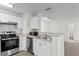 Modern kitchen with stainless steel appliances and white cabinets at 18001 Richmond Place Dr # 734, Tampa, FL 33647