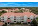 Aerial view of a multi-unit residential building with red tile roofs at 18001 Richmond Place Dr # 734, Tampa, FL 33647