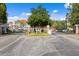 Gated community entrance with lush landscaping and ample parking at 18001 Richmond Place Dr # 734, Tampa, FL 33647