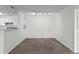 Dining room with carpet flooring and kitchen bar at 18001 Richmond Place Dr # 734, Tampa, FL 33647