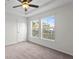 Spacious bedroom with two windows and ceiling fan at 18001 Richmond Place Dr # 734, Tampa, FL 33647