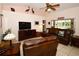 Comfortable living room with leather sofas and access to a back patio at 3204 Stagecoach Trl, Wimauma, FL 33598