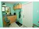Laundry room with cabinets, counter space, and exterior access at 3204 Stagecoach Trl, Wimauma, FL 33598