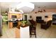 Open floor plan boasting a spacious kitchen with island and adjoining living room at 3204 Stagecoach Trl, Wimauma, FL 33598