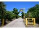 Entrance to Sundance Marina with yellow gate at 3204 Stagecoach Trl, Wimauma, FL 33598