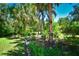 Serene garden with diverse plantings, creating a peaceful outdoor space at 3204 Stagecoach Trl, Wimauma, FL 33598