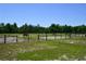 Spacious horse paddocks with wooden fencing at 3204 Stagecoach Trl, Wimauma, FL 33598