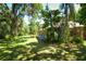 Landscaped backyard with tropical plants at 3204 Stagecoach Trl, Wimauma, FL 33598