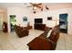 Spacious living room with leather furniture and views into other rooms at 3204 Stagecoach Trl, Wimauma, FL 33598
