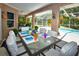 Relaxing patio with pool view, dining table and grill at 3204 Stagecoach Trl, Wimauma, FL 33598