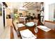 Open dining room with a wooden table and access to the kitchen at 3204 Stagecoach Trl, Wimauma, FL 33598