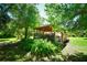 Wooden pergola in the backyard, perfect for relaxation in the shade at 3204 Stagecoach Trl, Wimauma, FL 33598