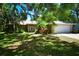 Charming ranch home with a two-car garage and beautifully landscaped yard at 3204 Stagecoach Trl, Wimauma, FL 33598