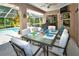 Outdoor patio with seating for six, adjacent to the pool at 3204 Stagecoach Trl, Wimauma, FL 33598