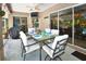 Covered patio features dining area with pool view at 3204 Stagecoach Trl, Wimauma, FL 33598