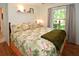King-size bedroom with wood floors and access to backyard views at 3204 Stagecoach Trl, Wimauma, FL 33598